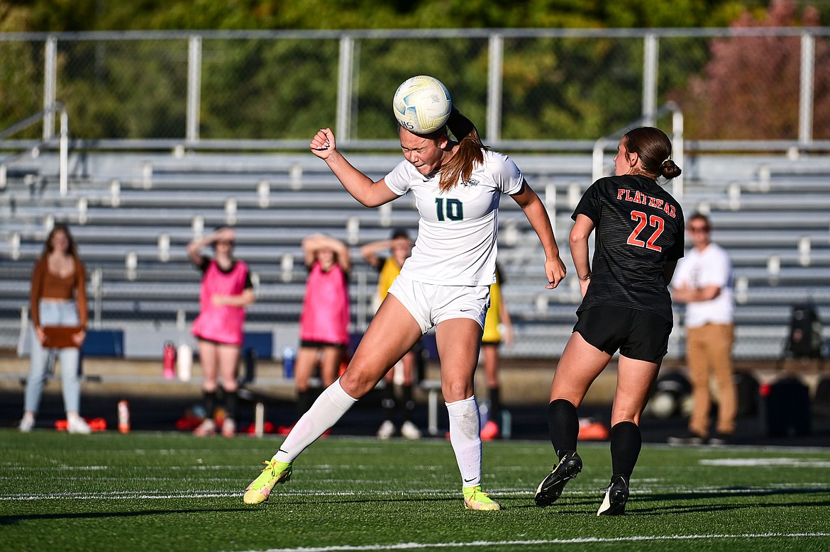 Glacier's Gracie Winkler (10) heads a ball upfield against Flathead at Legends Stadium on Thursday, Sept. 26. (Casey Kreider/Daily Inter Lake)