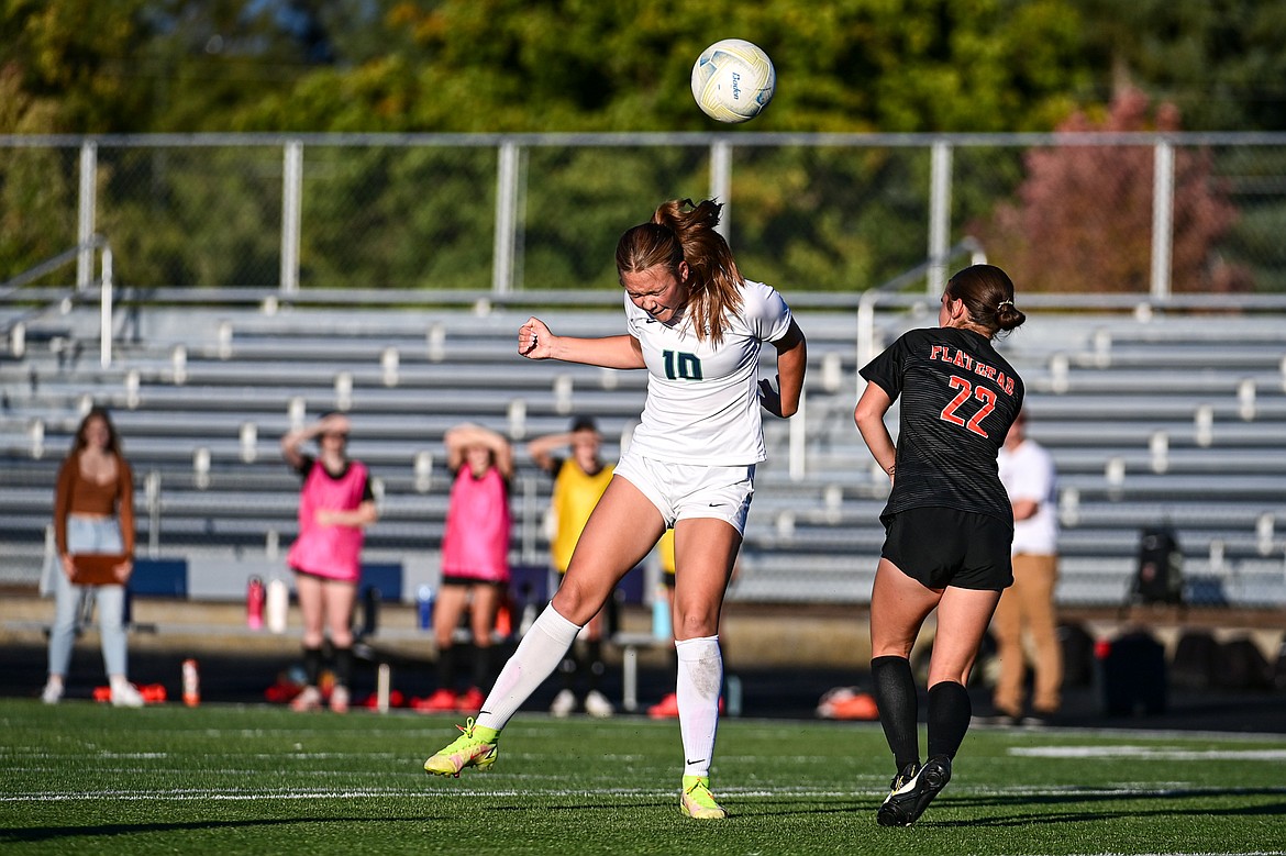 Glacier's Gracie Winkler (10) heads a ball upfield against Flathead at Legends Stadium on Thursday, Sept. 26. (Casey Kreider/Daily Inter Lake)