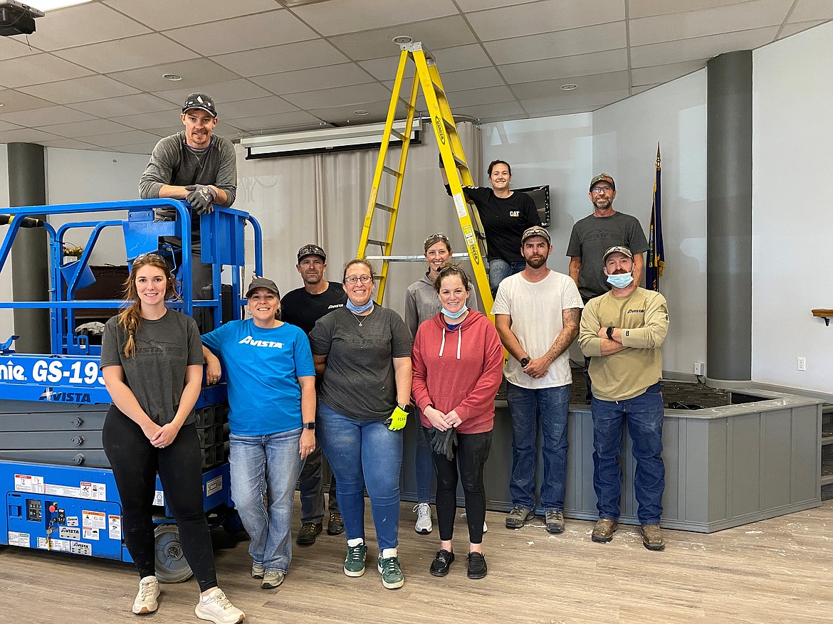 A group of volunteers from Avista helped with ceiling tile work during Thursday's Day of Caring event.