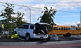 Street signs damaged after crash near roundabout by Post Falls High School