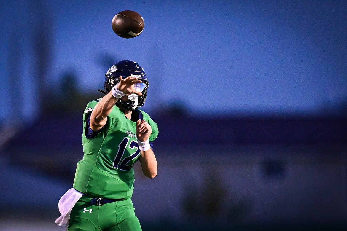 Glacier quarterback Jackson Presley (12) throws in the second quarter against Missoula Hellgate at Legends Stadium on Friday, Sept. 27. (Casey Kreider/Daily Inter Lake)