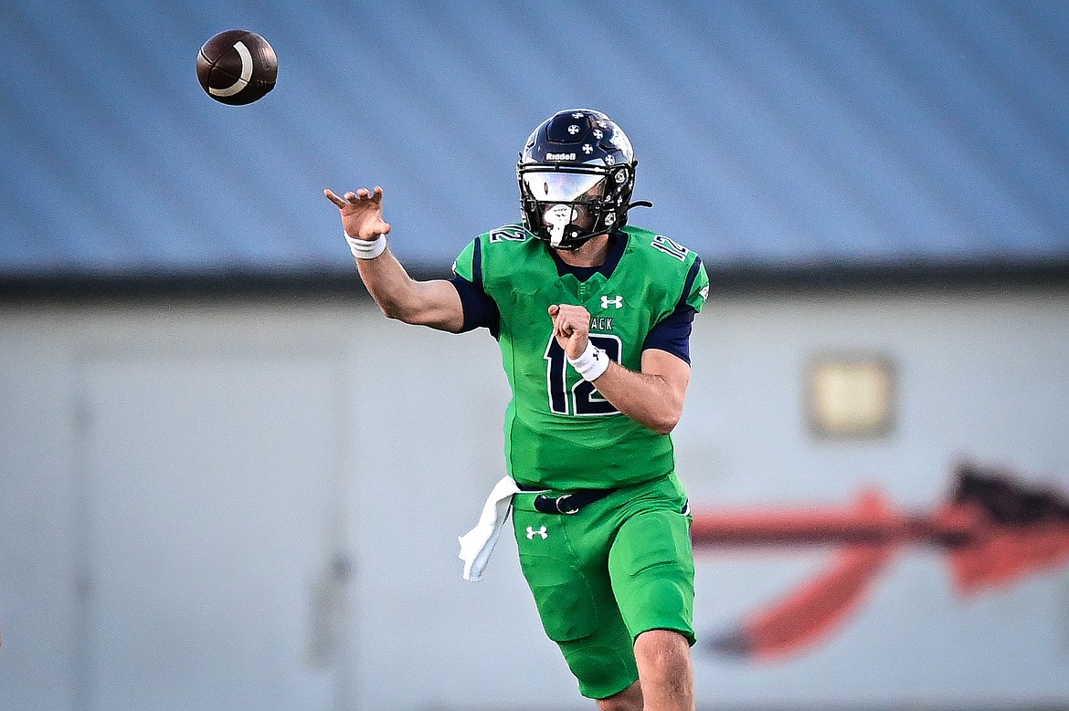 Glacier quarterback Jackson Presley (12) throws in the first quarter against Missoula Hellgate at Legends Stadium on Friday, Sept. 27. (Casey Kreider/Daily Inter Lake)