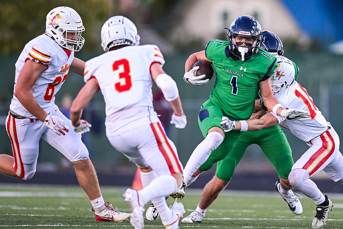 Glacier wide receiver Bridger Smith (1) picks up yardage after a reception in the first quarter against Missoula Hellgate at Legends Stadium on Friday, Sept. 27. (Casey Kreider/Daily Inter Lake)