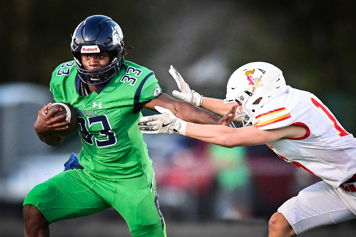 Glacier running back Kobe Dorcheus (33) looks for running room in the first quarter against Missoula Hellgate at Legends Stadium on Friday, Sept. 27. (Casey Kreider/Daily Inter Lake)