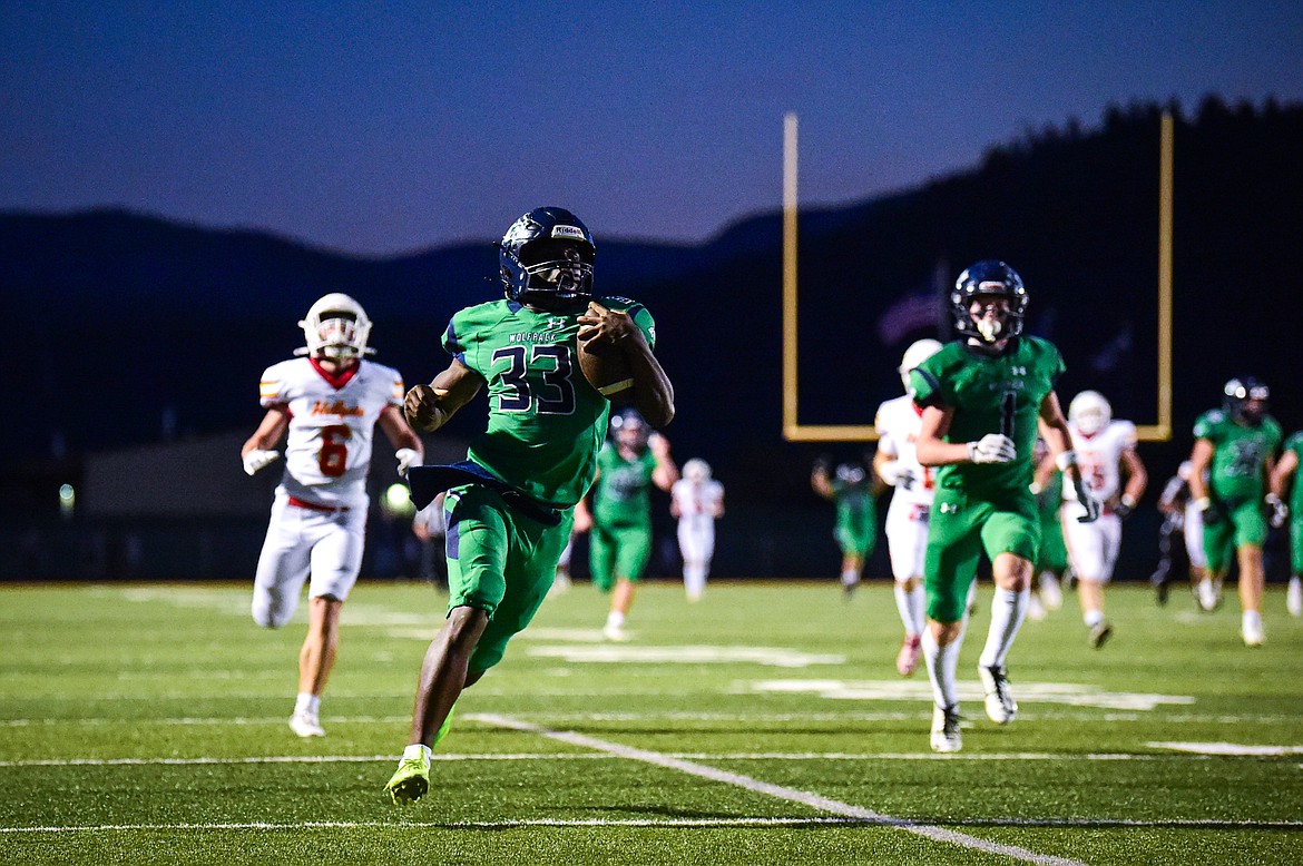 Glacier running back Kobe Dorcheus (33) breaks loose on a 95-yard touchdown run in the second quarter against Missoula Hellgate at Legends Stadium on Friday, Sept. 27. (Casey Kreider/Daily Inter Lake)