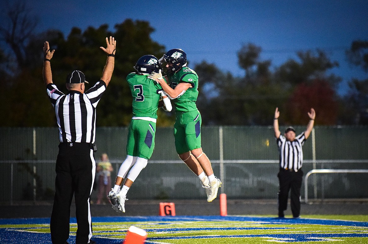 Glacier wide receiver Micah Klippenstein (3) and tight end Matthew Junk (45) celebrate after Klippenstein's touchdown reception in the second quarter against Missoula Hellgate at Legends Stadium on Friday, Sept. 27. (Casey Kreider/Daily Inter Lake)