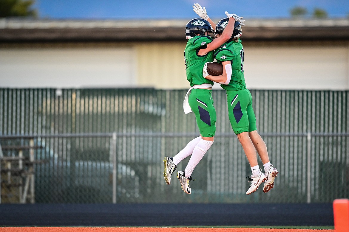 Glacier wide receivers Bridger Smith (1) and Easton Kauffman (19) celebrate after Kauffman's touchdown reception in the first quarter against Missoula Hellgate at Legends Stadium on Friday, Sept. 27. (Casey Kreider/Daily Inter Lake)