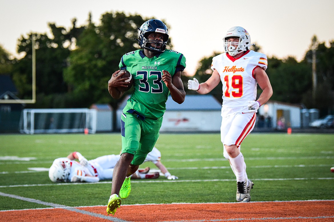 Glacier running back Kobe Dorcheus (33) scores a touchdown on a 6-yard run in the first quarter against Missoula Hellgate at Legends Stadium on Friday, Sept. 27. (Casey Kreider/Daily Inter Lake)