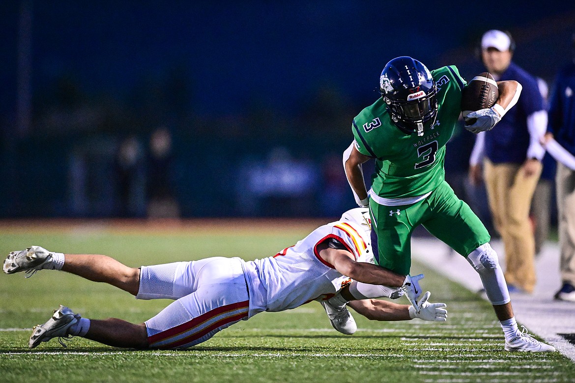 Glacier wide receiver Micah Klippenstein (3) picks up yardage after a reception in the second quarter against Missoula Hellgate at Legends Stadium on Friday, Sept. 27. (Casey Kreider/Daily Inter Lake)