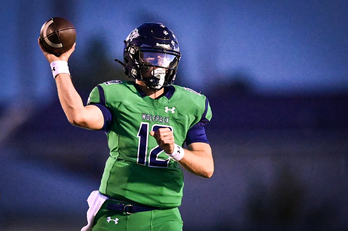 Glacier quarterback Jackson Presley (12) throws in the second quarter against Missoula Hellgate at Legends Stadium on Friday, Sept. 27. (Casey Kreider/Daily Inter Lake)