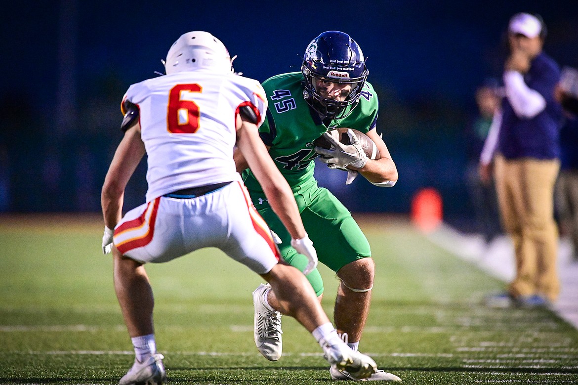 Glacier tight end Matthew Junk (45) picks up yardage after a reception in the second quarter against Missoula Hellgate at Legends Stadium on Friday, Sept. 27. (Casey Kreider/Daily Inter Lake)