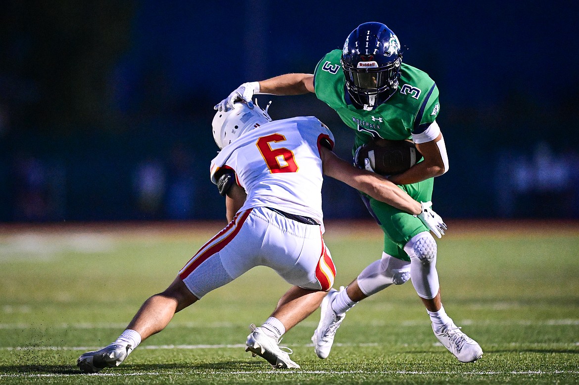 Glacier wide receiver Micah Klippenstein (3) picks up yardage after a reception in the second quarter against Missoula Hellgate at Legends Stadium on Friday, Sept. 27. (Casey Kreider/Daily Inter Lake)