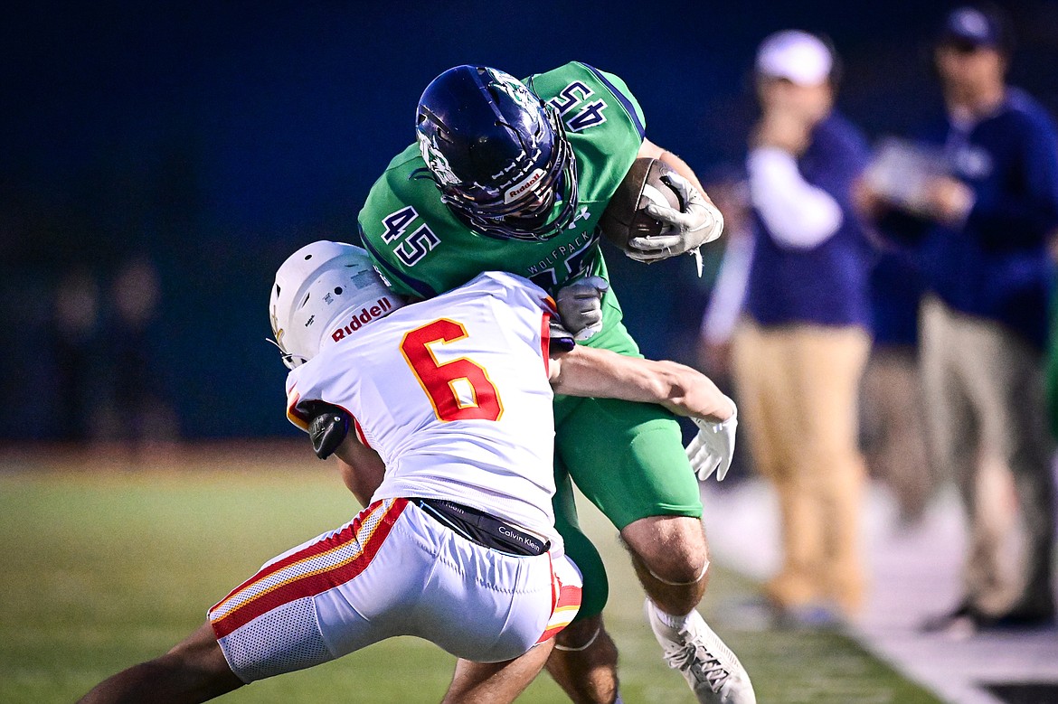 Glacier tight end Matthew Junk (45) picks up yardage after a reception in the second quarter against Missoula Hellgate at Legends Stadium on Friday, Sept. 27. (Casey Kreider/Daily Inter Lake)