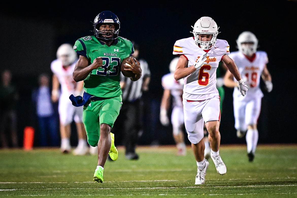 Glacier running back Kobe Dorcheus (33) breaks loose on a 95-yard touchdown run in the second quarter against Missoula Hellgate at Legends Stadium on Friday, Sept. 27. (Casey Kreider/Daily Inter Lake)