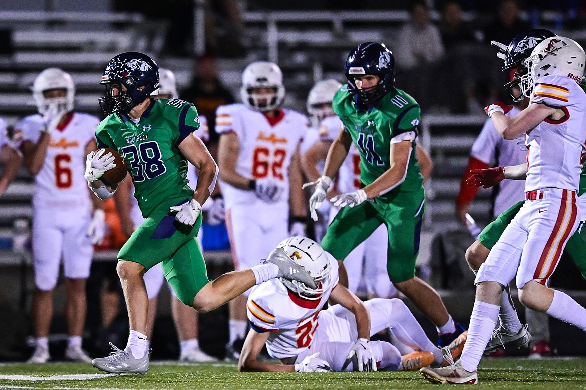 Glacier kick returner Carson Baker (38) returns a kickoff for a touchdown in the third quarter against Missoula Hellgate at Legends Stadium on Friday, Sept. 27. (Casey Kreider/Daily Inter Lake)