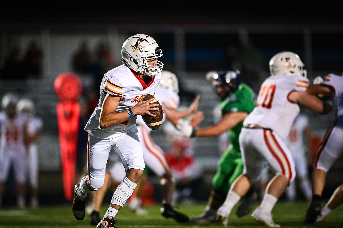 Missoula Hellgate quarterback Vince Paffhausen (7) rolls out in the second quarter against Glacier at Legends Stadium on Friday, Sept. 27. (Casey Kreider/Daily Inter Lake)