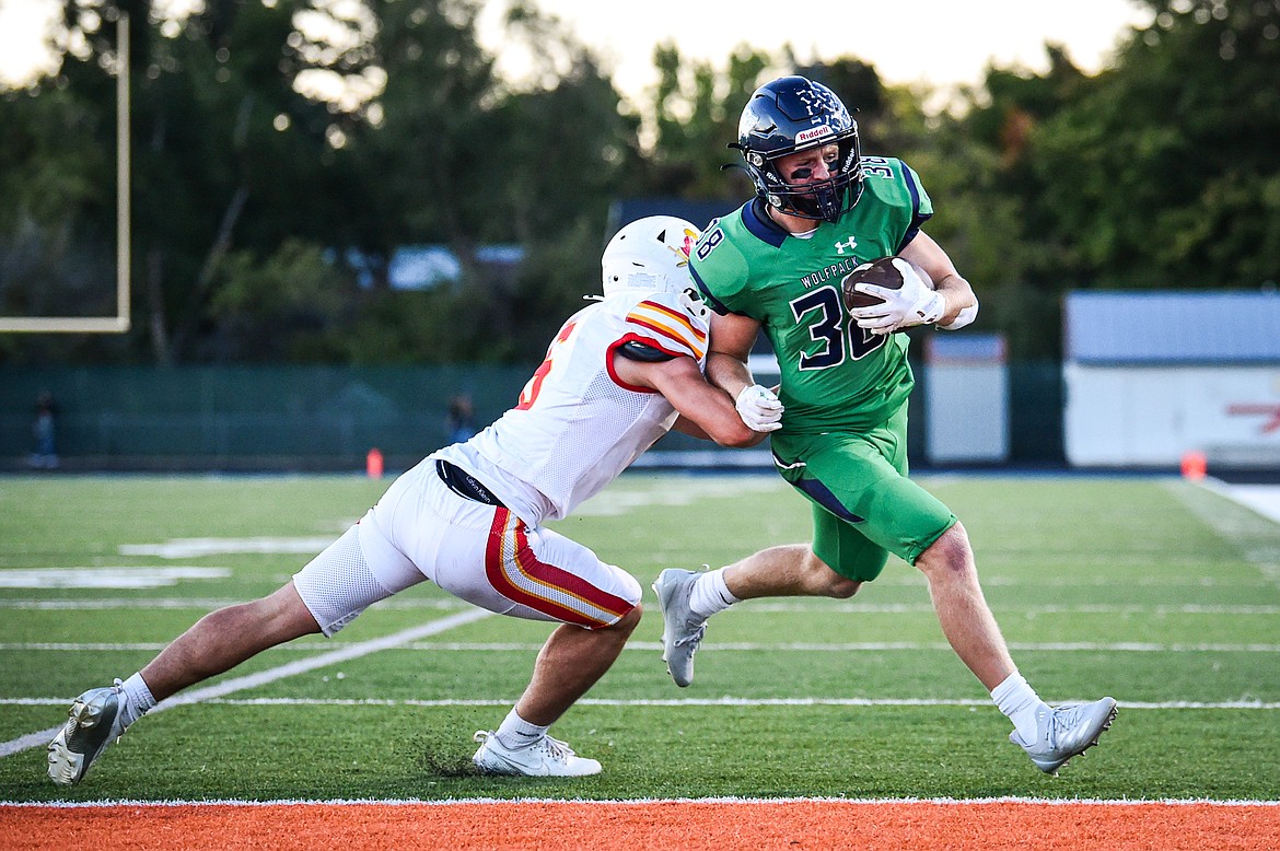 Glacier wide receiver Carson Baker (38) scores a touchdown on a reverse in the first quarter against Missoula Hellgate at Legends Stadium on Friday, Sept. 27. (Casey Kreider/Daily Inter Lake)