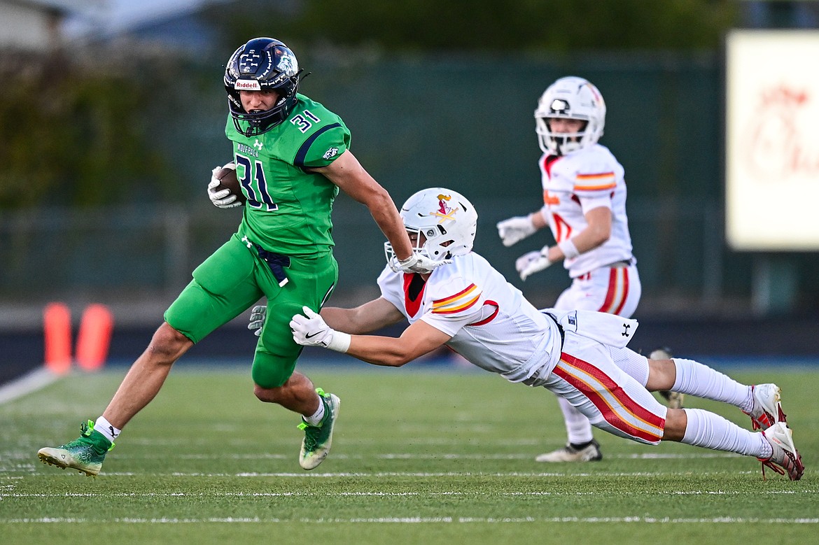 Glacier tight end Mark Ahner (31) picks up yardage after a reception in the first quarter against Missoula Hellgate at Legends Stadium on Friday, Sept. 27. (Casey Kreider/Daily Inter Lake)