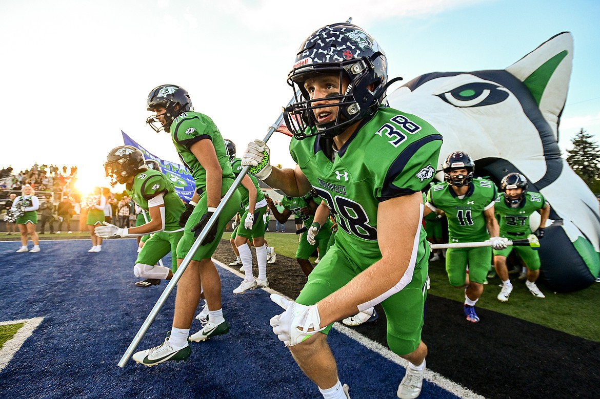 The Glacier Wolfpack take the field before their matchup against Missoula Hellgate at Legends Stadium on Friday, Sept. 27. (Casey Kreider/Daily Inter Lake)