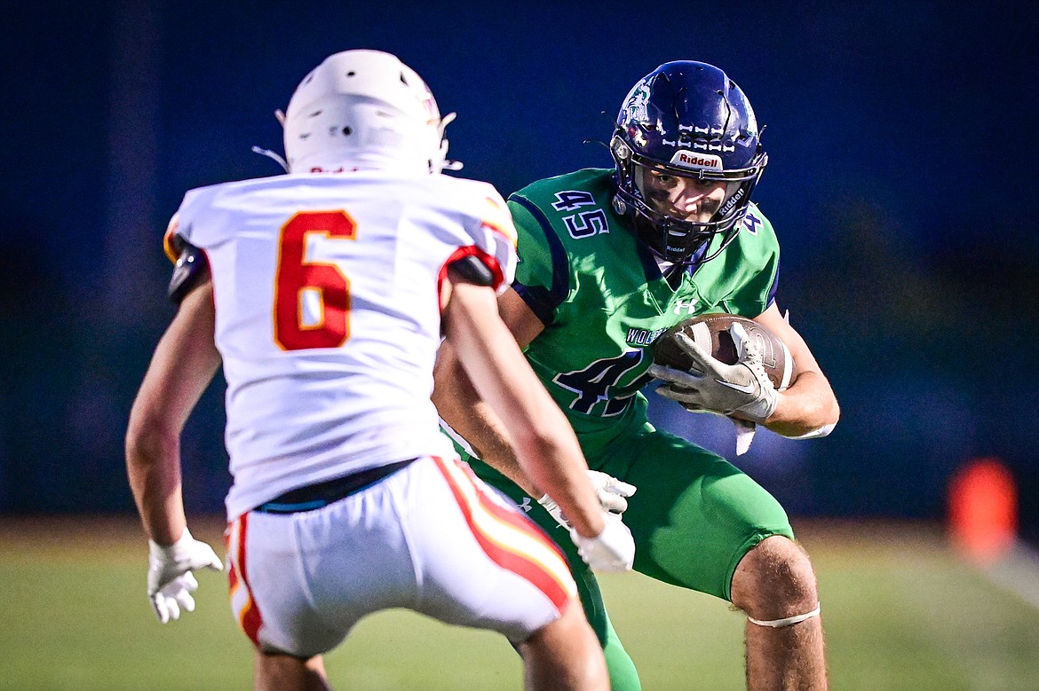 Glacier tight end Matthew Junk (45) picks up yardage after a reception in the second quarter against Missoula Hellgate at Legends Stadium on Friday, Sept. 27. (Casey Kreider/Daily Inter Lake)