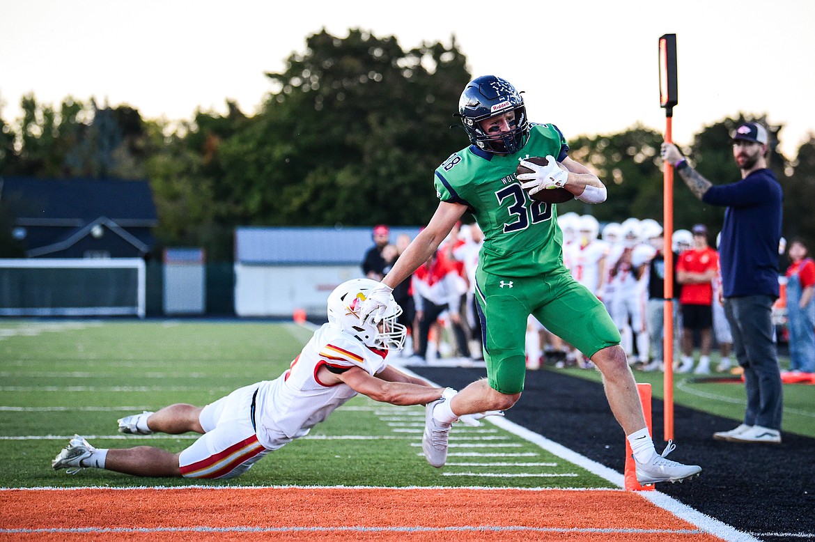 Glacier wide receiver Carson Baker (38) scores a touchdown on a reverse in the first quarter against Missoula Hellgate at Legends Stadium on Friday, Sept. 27. (Casey Kreider/Daily Inter Lake)