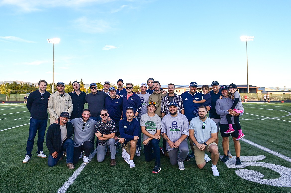 Members of the Glacier Wolfpack's 2014 state championship team are honored at Legends Stadium before the Wolfpack's game against Missoula Hellgate on Friday, Sept. 27. (Casey Kreider/Daily Inter Lake)