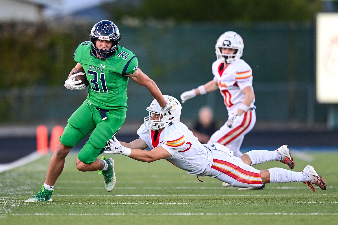 Glacier tight end Mark Ahner (31) picks up yardage after a reception in the first quarter against Missoula Hellgate at Legends Stadium on Friday, Sept. 27. (Casey Kreider/Daily Inter Lake)