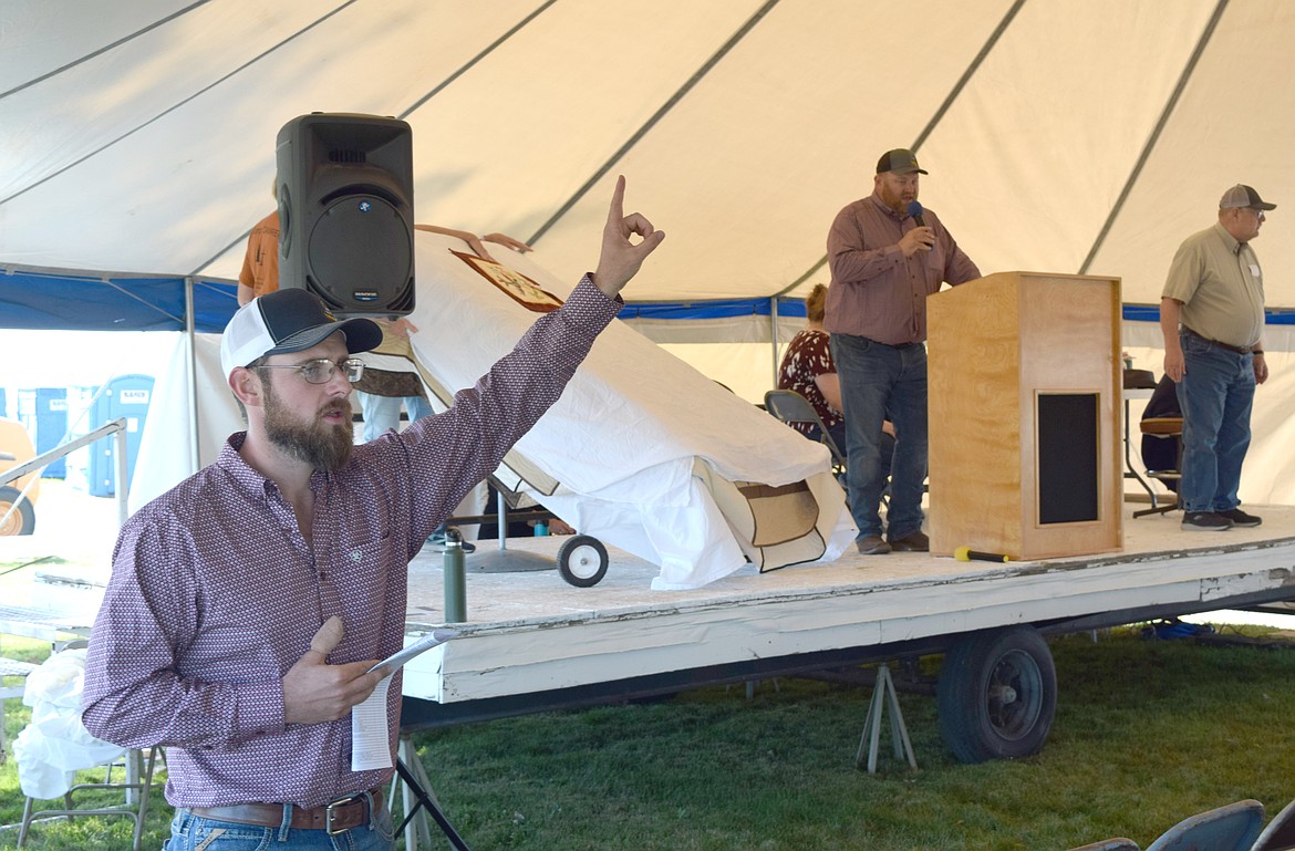 Auctioneers take bids at last year’s Mennonite Country Auction near Ritzville. This year’s auction is Saturday.