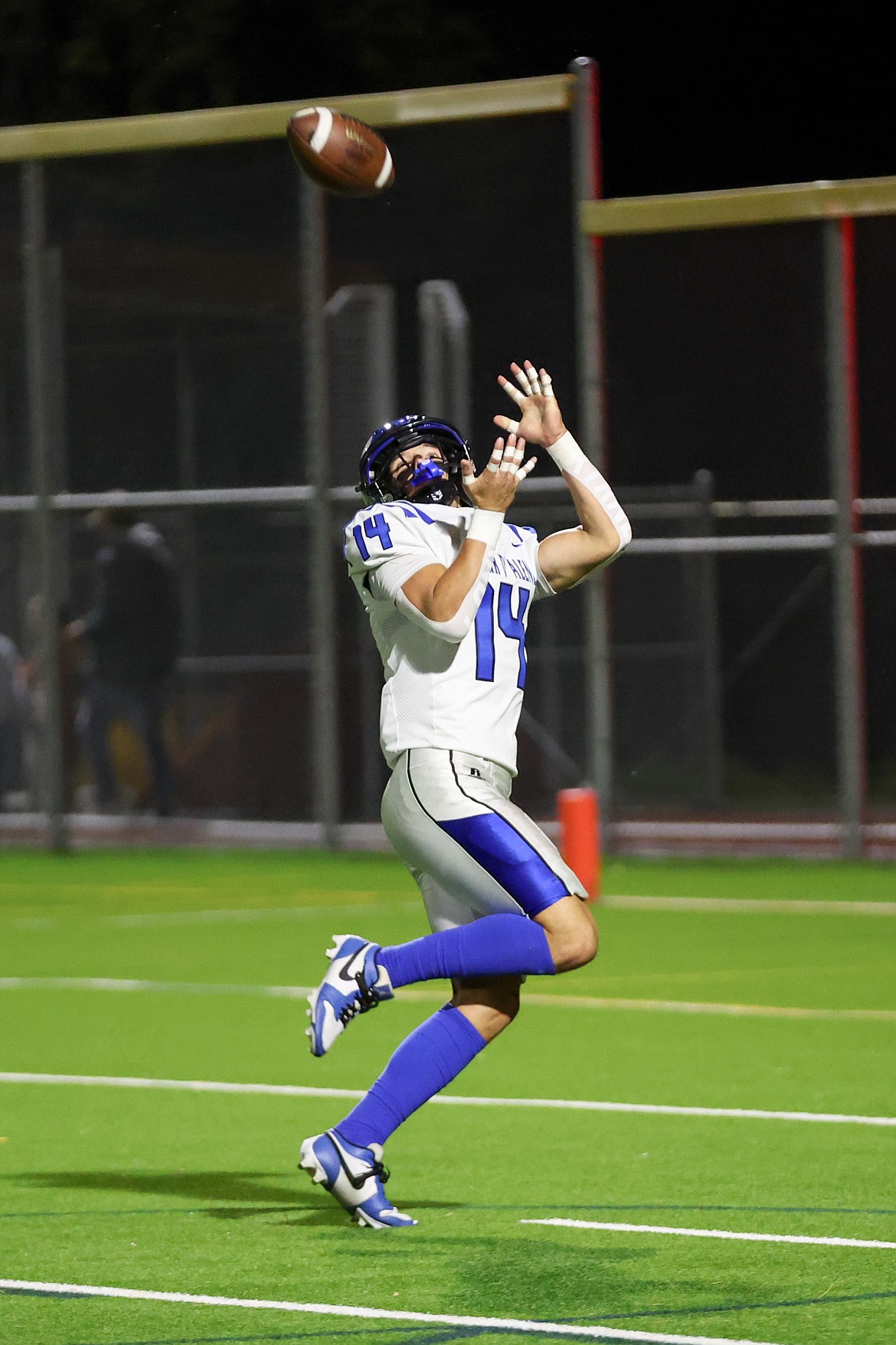 JASON DUCHOW PHOTOGRAPHY
Kai Wheeler of Coeur d'Alene hauls in a touchdown pass against Sandpoint on Friday night at Barlow Stadium in Sandpoint.