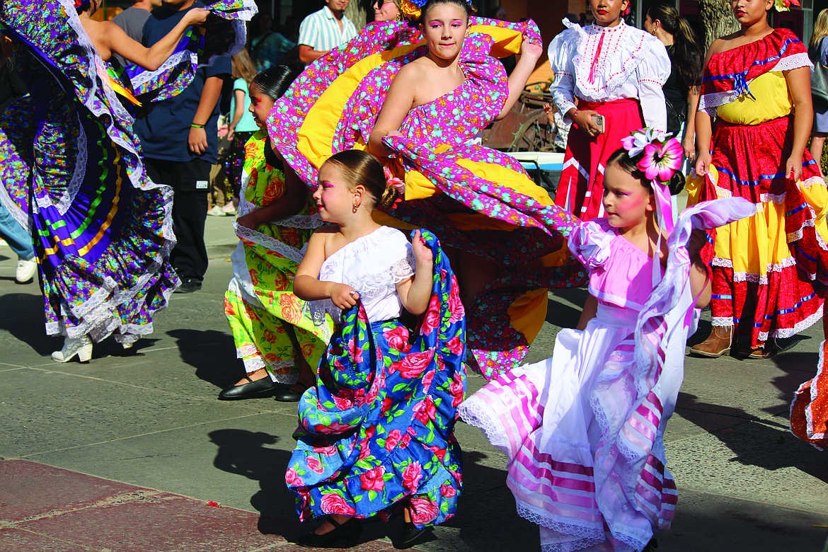 Dancers from Ballet Sol y Luna, Quincy, wore their most colorful dresses in the Quincy FCAD parade.