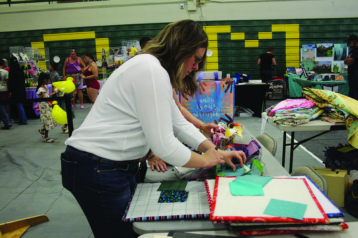 Rebekah Kaylor designs a block for a quilt to be raffled for the Quincy Special Olympics team. The volunteer project was new to FCAD 2024.