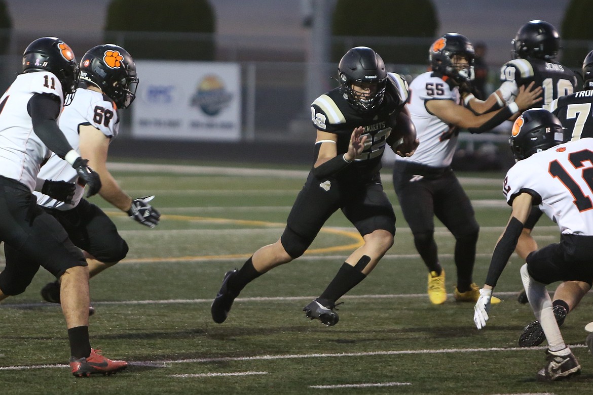 Royal senior Ethan Ellis (22) carries the football during an 11-yard run in the first quarter against Zillah on Friday. Ellis finished the game with eight carries for 97 yards and a touchdown.