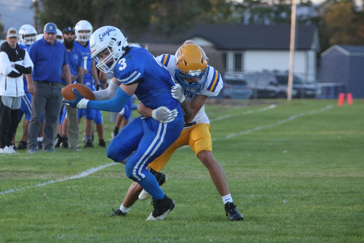 Soap Lake senior Robby Fisher (3) fights for extra yards on a 17-yard touchdown catch in the second quarter against Wellpinit on Thursday.