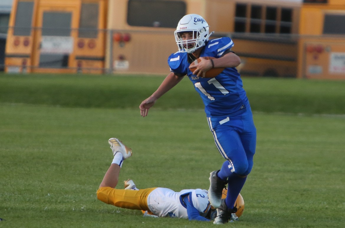 Soap Lake junior Logan Northup (11) breaks a tackle and advances up field on a catch-and-run in the second quarter.