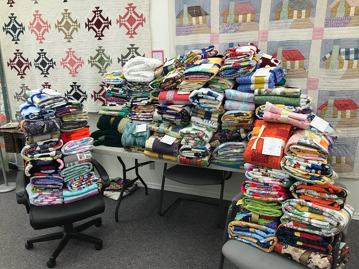 Stacks of blankets wait to be given away by the Tri-Cities chapter of Project Linus. The chapter puts out 100-125 blankets a month.