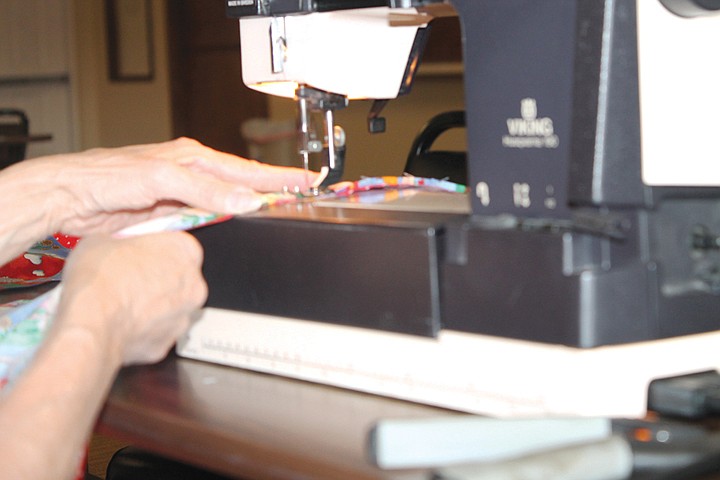 Belinda Chambers sews a blanket for the Ephrata chapter of Project Linus in 2013. The chapter has been going since 2004, and Chambers took over as coordinator in 2008, she said.