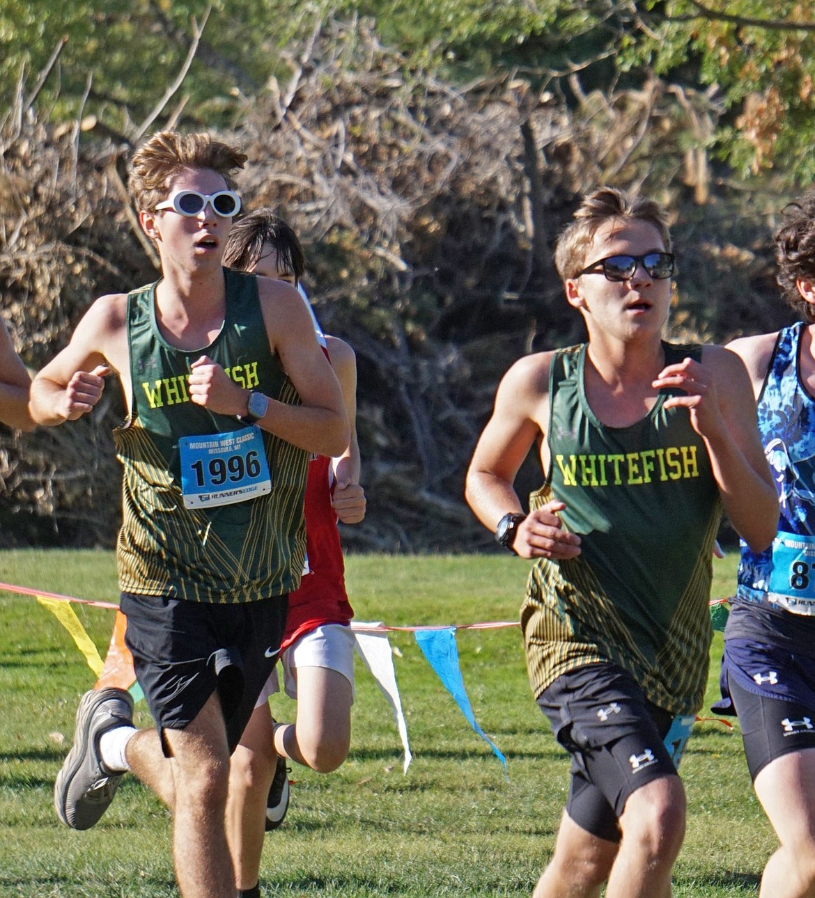 Freshmen Peter Schram (left) and Mason Loeffler (right) sprint toward the finish at the Mountain West Classic on Saturday. (Matt Weller photo)