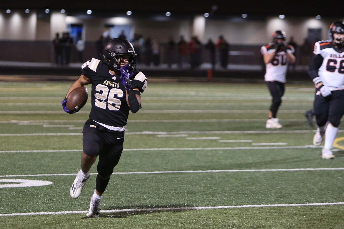 Royal senior Kevin Gutierrez (26) carries the football on a long run during Friday’s 49-21 win against Zillah.