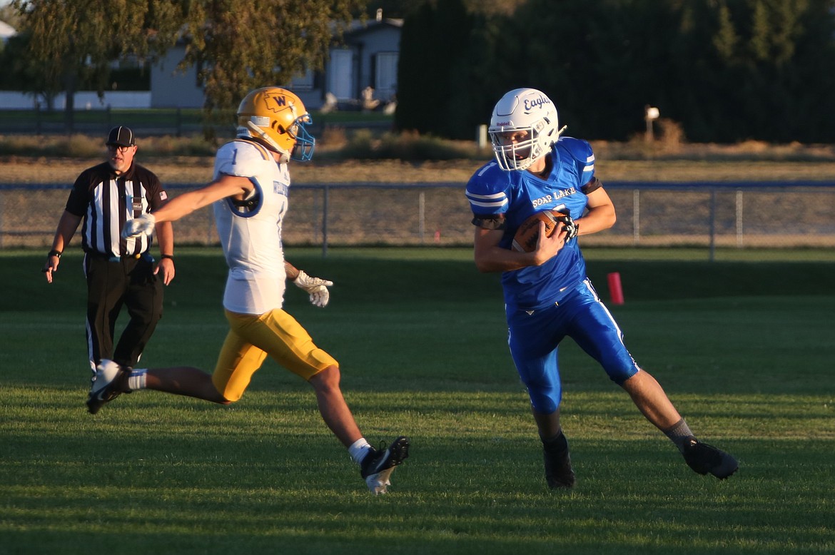 Soap Lake senior Ruvim Goloborodko (1) looks to take on an incoming Wellpinit defender during Thursday’s loss to the Redskins.