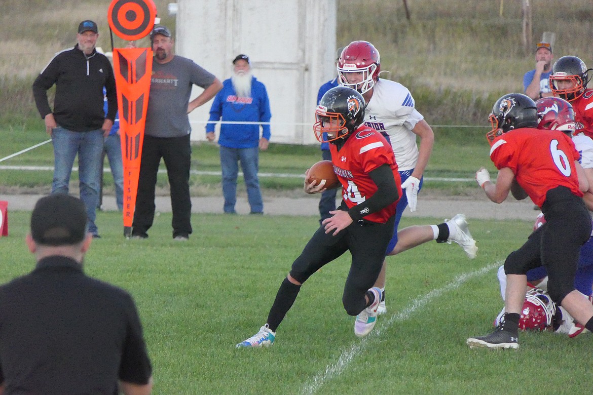 Plains senior quarterback Darren Standeford looks for running room during the Horsemen's game versus Superior this past Friday in Plains.  (Chuck Bandel/VP-MI)