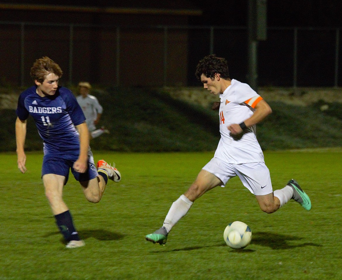 EMILY BONSANT/Bonners Ferry Herald
Malachi Chafin, right, of Post Falls works the ball upfield as Jesse Fess of Bonners Ferry defends on Monday night in Bonners Ferry.