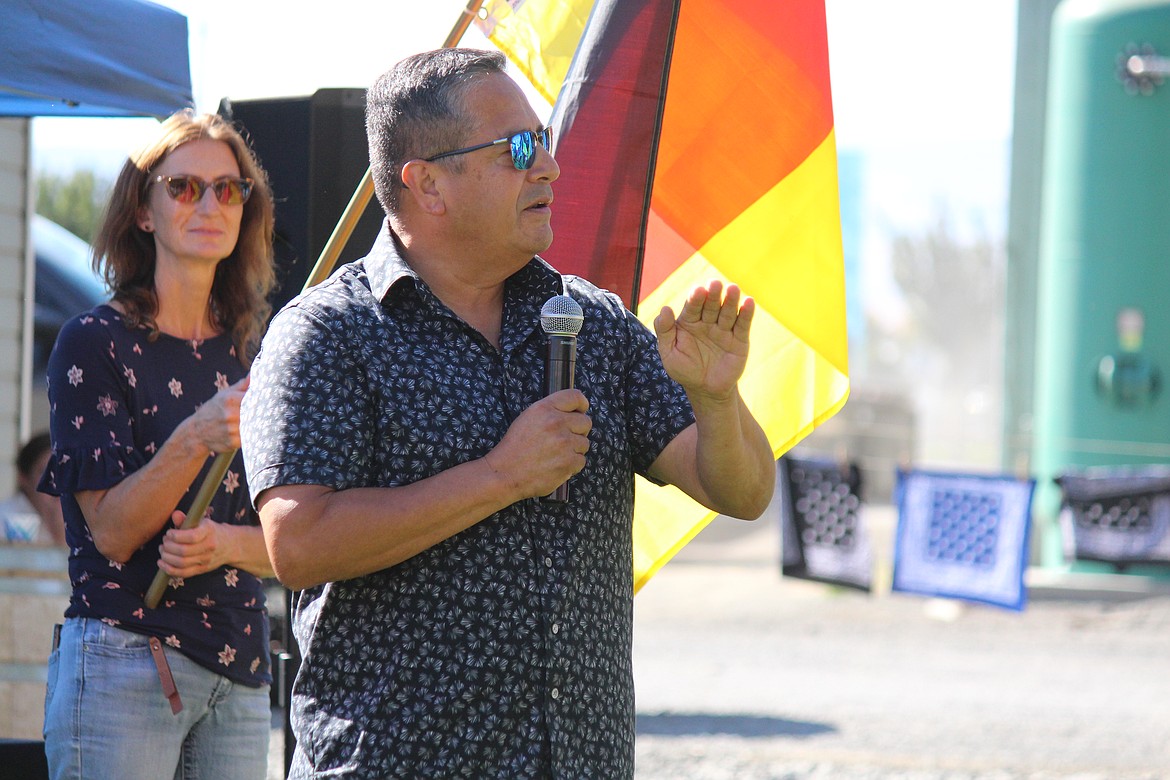 Quincy native Alex Ybarra speaks during the harvest and culture celebration.