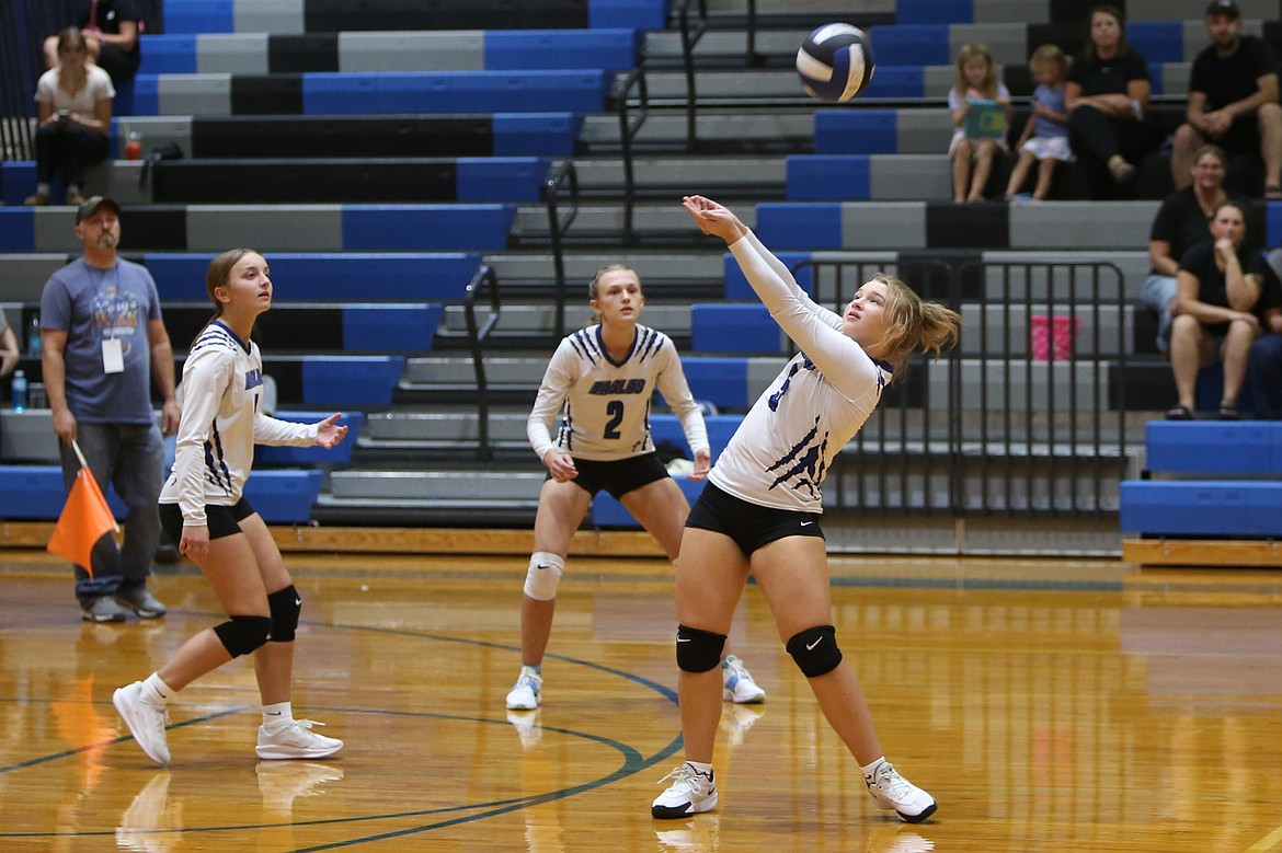 Soap Lake sophomore Liana Sushik, right, bumps the ball over the net during the first set against Republic on Saturday. The Eagles won the match 3-0 to remain unbeaten.