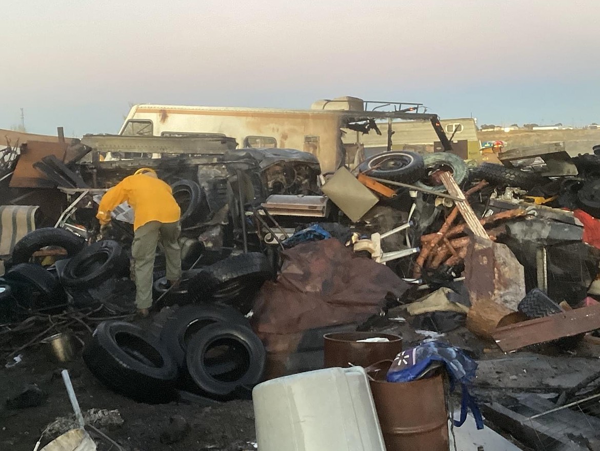 Adams County Fire District 5 responded to an RV blaze outside of Othello on Sunday. The firefighters struggled to bring water in because of the narrow and cluttered driveway.