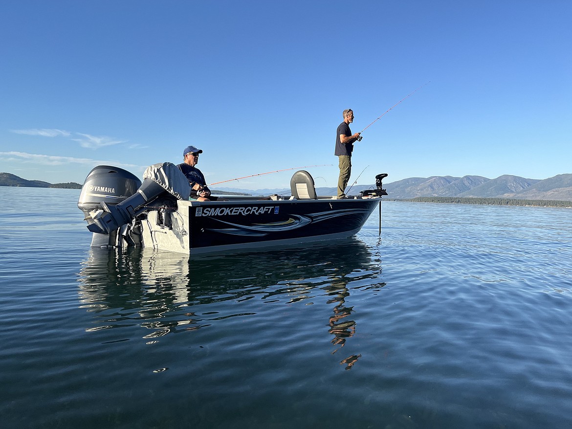 Anglers made the most of a tranquil Saturday evening on Flathead Lake, just north of Boettcher Park. Conditions changed Sunday, when gusty winds roiled the lake but failed to deter Mack Days contestants. (Kristi Niemeyer/Leader)