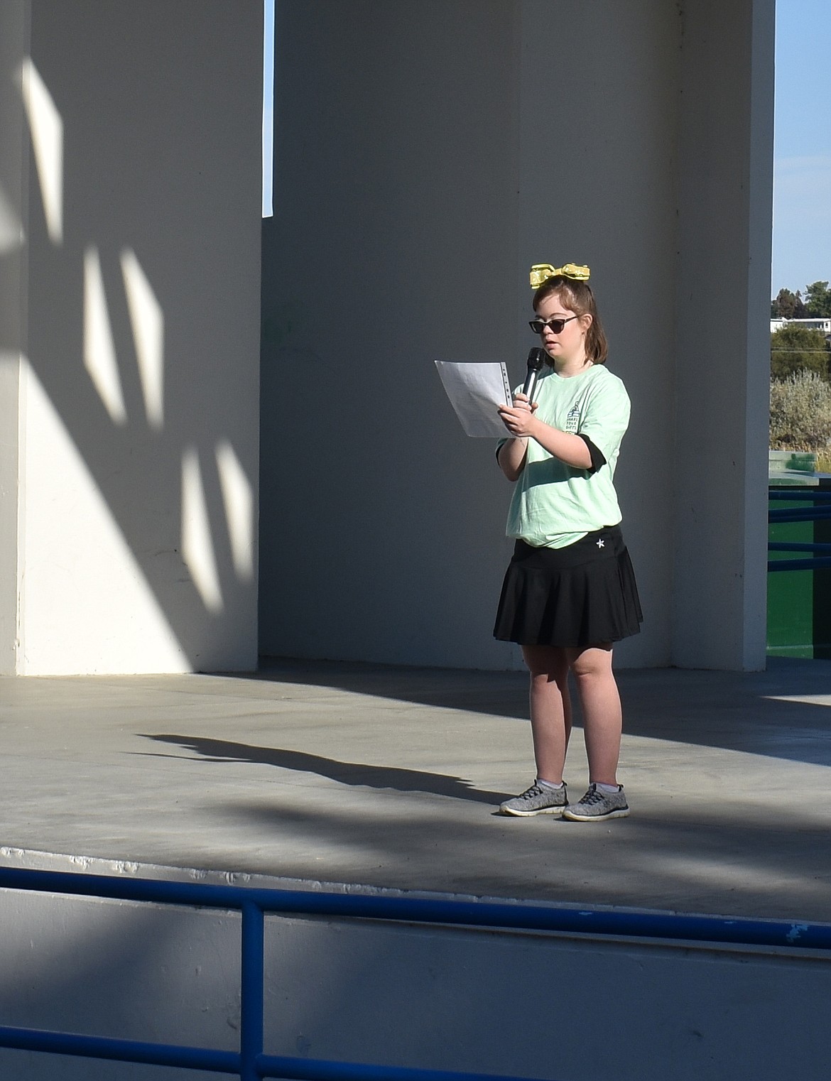 Abigail Marick shares her gift at the Buddy walk Saturday by reading a poem she wrote about being different.