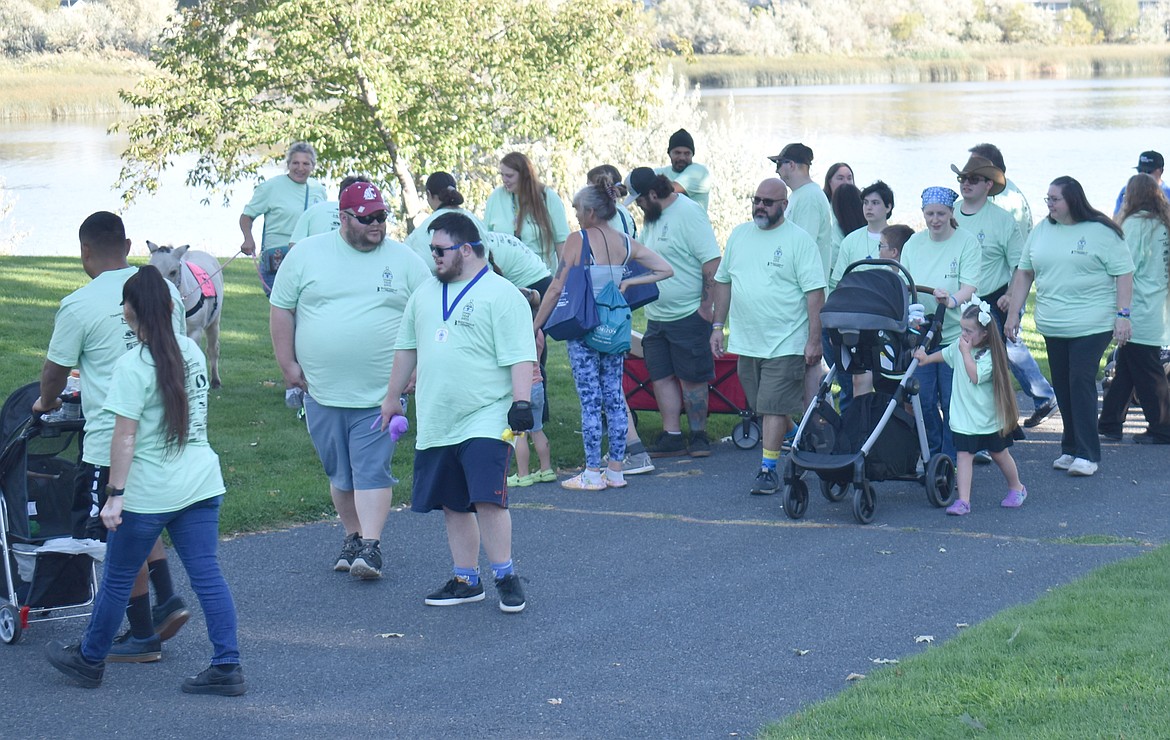 People with Down syndrome, joined by friends and family, set out on the Down Syndrome Society of Grant County Buddy Walk Saturday in downtown Moses Lake.