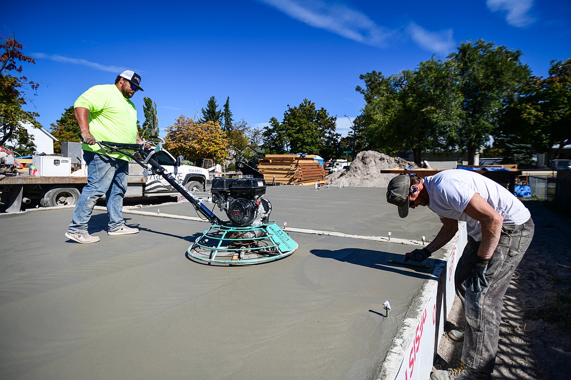 A crew from Hardcore Concrete finishes the concrete foundation of Habitat for Humanity of Flathead Valley's Kalispell Townhome Project at Seventh Street West and Ninth Avenue West in Kalispell on Tuesday, Oct. 1. (Casey Kreider/Daily Inter Lake)