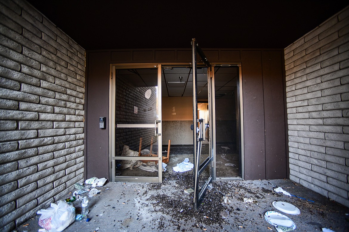 A smashed glass door left open at the former Fairbridge Inn & Suites and Outlaw Convention Center in Kalispell on Tuesday, Oct. 1. (Casey Kreider/Daily Inter Lake)