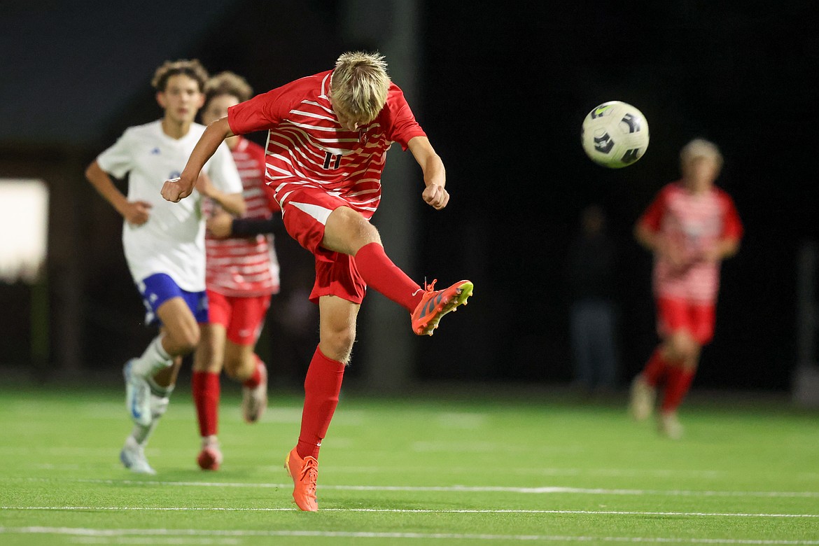 Sandpoint High junior forward Huxley Hall fires a shot during Tuesday night's match against Coeur d'Alene at War Memorial Field.